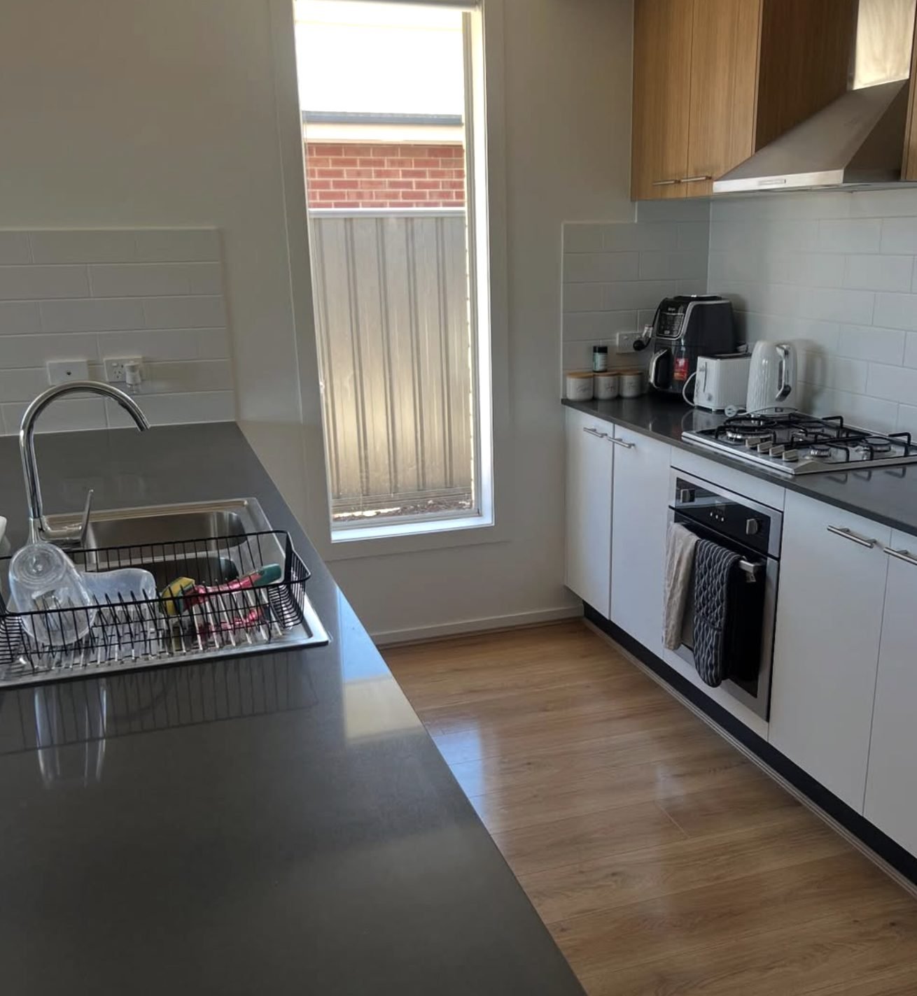 Clean kitchen worktops and hob after a domestic clean